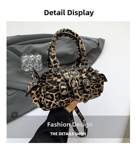 Detail of leopard print crossbody bag with metal buckle and adjustable shoulder strap