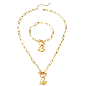 Polished gold paperclip chain jewelry set with heart pendant and toggle clasp