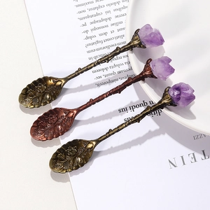 Vintage bronze and copper spoons with amethyst crystals and floral embossed details