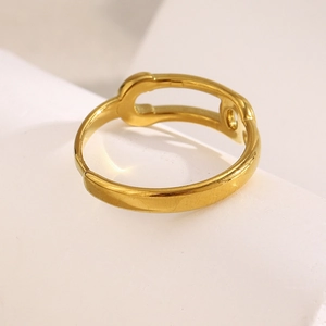 Detail of 18K gold plated safety pin open ring with polished hollow arc structure
