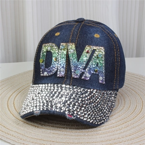 Close-up of denim baseball cap featuring rainbow DIVA sequins and rhinestone brim detail