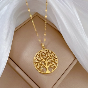 Elegant gold tree of life pendant necklace with detailed engraved leaves for women