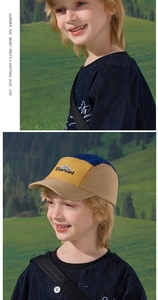 Detail of embroidered Daniel logo and mountain motif on kids color block baseball cap