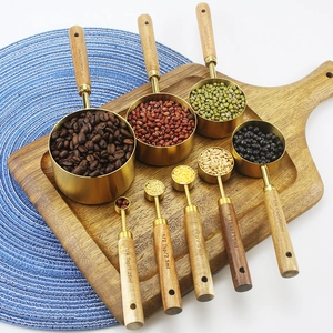 8-piece gold stainless steel measuring cups and spoons set with acacia wood handles
