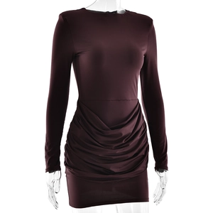 Detail view of burgundy ruched bodycon dress with elegant draping and crew neckline