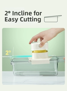 Detail of vegetable slicer with 2-degree ergonomic tilt and safety hand guard design