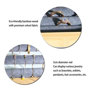 Bamboo jewelry display stand with gray velvet cylinder and ring slots for necklaces