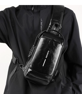 Men's leather sling bag detail featuring anti-theft combination lock and USB port