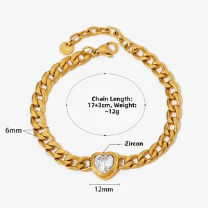 Detail of 6mm gold Cuban link bracelet with 12mm heart zircon pendant and clasp