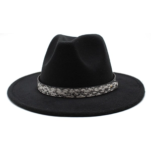 Close-up of black wool fedora featuring snake print band and golden metal buckle