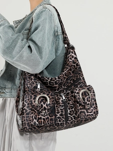 Stylish leopard print underarm tote bag with front buckle pockets and shoulder straps