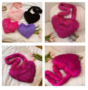 Detail view of heart-shaped faux fox fur bags in pink, black, rose red and purple