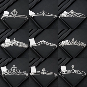 Selection of elegant silver bridal tiaras with sparkling rhinestones and white pearls
