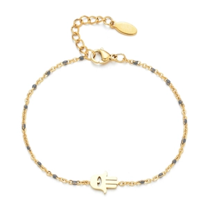 Detail of gold Hamsa hand bracelet with eye symbol and gray enamel beads on chain