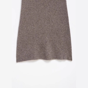 Fashionable taupe knit mini dress featuring ribbed hem details and premium wool texture
