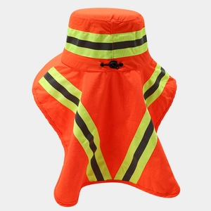 Detail view of high-visibility orange safety hat with reflective stripes and neck protector