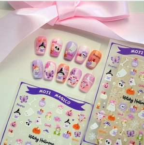 Detail of Witchy Halloween nail stickers and press-on nails with cute cartoon ghost patterns