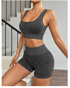 Detailed close-up of dark grey ribbed yoga set with high-waist shorts and sports bra