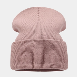 Detailed view of dusty rose ribbed knit beanie with thick fold-over cuff for winter warmth