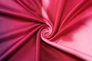 Macro detail of high-quality gradient pink ribbed knit fabric for summer dresses