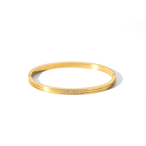 Minimalist 18k gold stainless steel bangle featuring a row of sparkling cubic zirconia