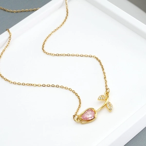 Gold tulip necklace with a pink pear-shaped zircon and sparkling diamond-set leaf