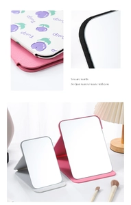 Detailed view of foldable PU leather makeup mirrors with tulip patterns and lychee texture