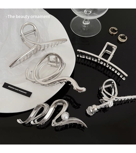 Detailed collection of silver metal shark hair claws with rose and pearl accents
