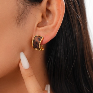 Vintage C-shaped faux calf hair earrings with leopard print and gold metal frames