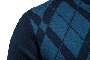 Detail of blue argyle pattern and fine knit texture on a men's stylish sweater