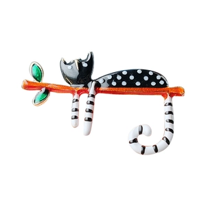 Cute spotted cat brooch with green leaves on orange branch made of enamel alloy