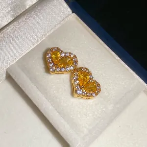 Exquisite gold-plated heart stud earrings with yellow pear-cut zircon and pave crystals