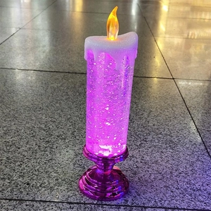 Detail of a purple LED crystal candle with internal glitter and liquid light effects