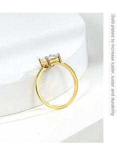 Detailed view of a gold plated ring with clear square zircon showing high luster finish