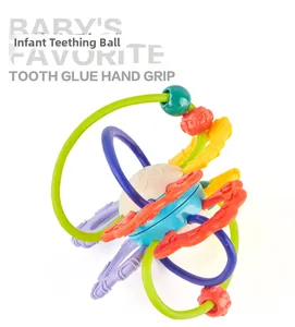 Macro view of colorful silicone teething loops and textured grip on the infant hand ball