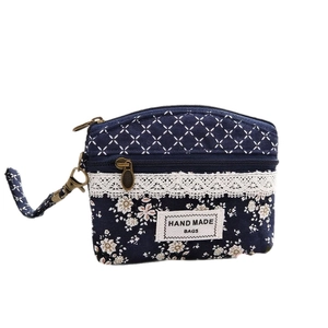 Floral and geometric dark blue patchwork coin purse with lace detail and hand strap