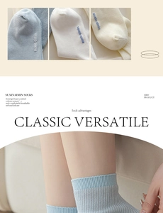 Detail of breathable combed cotton knit socks featuring fine embroidery and soft ribbing