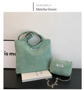 Detail of matcha green corduroy tote and small crossbody bag with gold chain strap