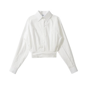 Close-up of white long-sleeved shirt featuring turn-down collar and pleated waist detail
