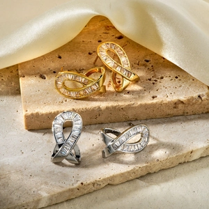 Crossed loop stud earrings with cubic zirconia in gold and silver finish for women