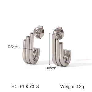 Detail view of silver triple-row tubular earrings with 1.68cm height dimensions
