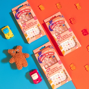 Cute cartoon kids press-on nails set with floral and rainbow patterns on colorful background