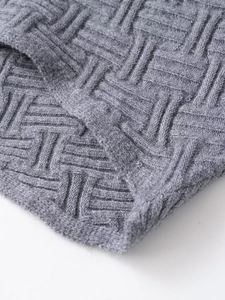 Close-up of gray knit fabric showing the detailed basketweave texture and high-quality fibers