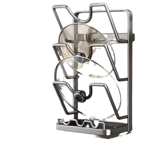 Wall-mounted dark grey metal pot lid rack with drip tray for kitchen storage