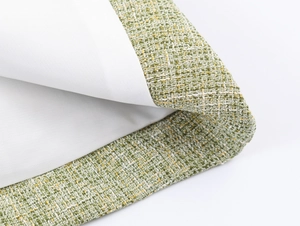 Detail shot of the green tweed fabric texture with premium woven yellow and white threads