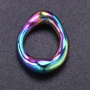 Macro shot of rainbow electroplated stainless steel oval pendant for DIY jewelry design