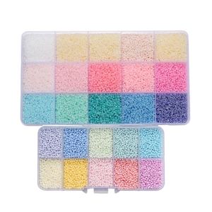 Detail of 15 and 10 grid boxes with colorful macaron glass seed beads for DIY jewelry