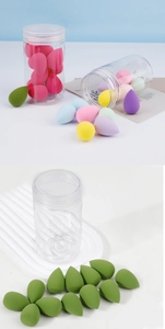 Detail of colorful water-drop makeup sponges and transparent cylindrical storage container