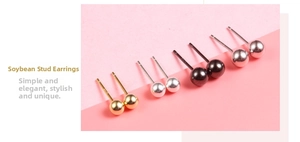Detailed view of four pairs of S925 sterling silver ball stud earrings in multiple colors