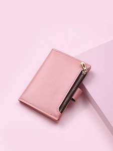 Detail view of pink PU leather wallet with buckle and functional side metal zipper pocket
